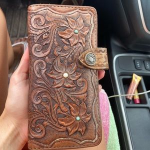 Hand tooled leather clutch